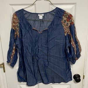 Wrangler denim with Aztec details. Size large.